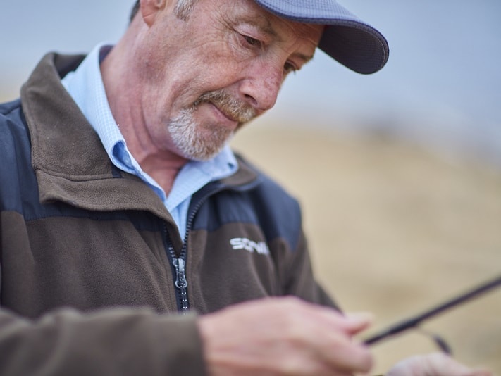 man holding fishing rod